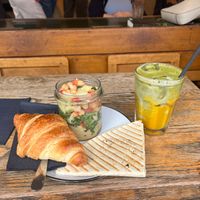 Bavarian chickpea salad, croissant and iced coconut mango matcha drink at A Little Lost in Munich