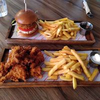 Top to bottom: chicken burger, oyster wings at Plant. Eat. Licious in Bath