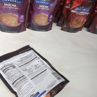 Hot Cocoa Mixes (Checking Ingredients)  at Ghirardelli Ice Cream and Chocolate Factory Outlet in San Leandro