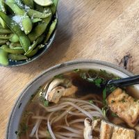 vegan pho with plenty of fresh herbs and edamame with lime and sea salt💗 at Mr Pho in Copenhagen
