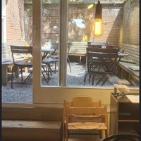 Courtyard seating (from the store's Google Maps page)  at Vlaamsch Broodhuys in Utrecht