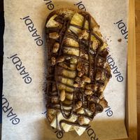 ‘Honestly good’ breakfast: Peanut & cocoa cream, toasted bread, banana.  at GIARDÍ  in Milan