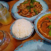 Drunken Thai Noodles, Thai Curry dish (with tofu), rice, and a lemonade drink with 'bubbles' at Rosa's Thai -  Kings Cross in North London