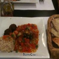 main course: Quinoa/Spinach balls with delicious puerto Rican sauce with tomatoes and pineapple. Home made bread also pictured, so good! at Lady Green Bio-Vegetarian Restaurant in Sitges