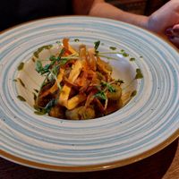 Spinach gnocchi with tomato sauce and fried veggies at Klauzál Café in Budapest