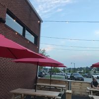 Outdoor seating area with cute lights  at Josies Pizza Bar in Glen Cove