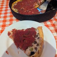 Onion, mushroom, and green pepper deep dish with vegan cheese. at Gino‘s East in Chicago