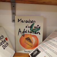 A bookshelf full of interesting literature at Coffea in Berlin