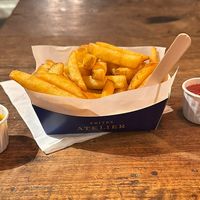 Fries with Piccadilly and ketchup sauces (the only two vegan sauces)  at Frites Atelier in Brussels
