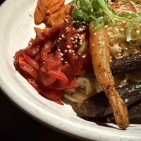 Chef’s creation with glazed carrots, wild-foraged Squamish mushrooms, yams, beans, peppers, noodles and peanut   at The Raven Room in Whistler
