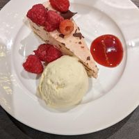 Christmas dessert offering Dec 2022 dark chocolate and raspberry cheesecake and vanilla ice cream at Cornkist in Ellon