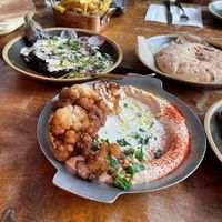 We had the smoked aubergine, hummus and fries 🍟   at Cult of Pita in Porto