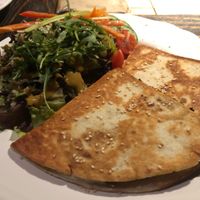 Vegan quesadilla bolognese with leafy greens at Radost Fina Kuhinjica in Belgrade
