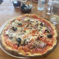 ORTOLANA
Tomato, vegan cheese, eggplant,
zucchini, mushroom, red
pepper, red onion, black olives
and oregano.  at Osteria El Italiano in Portomarin