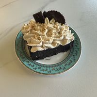 Chocolate peanut butter cake. It was amazing. Very dense and moist. Almost like fudge. Highly recommended   at Unicorniverse Bakery & Cafe in Round Rock