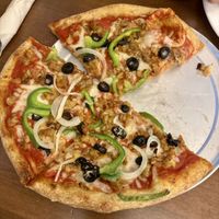 Small tempeh and light vegan cheese, as well as black olives, green peppers and onion.   at Mellow Mushroom in Cary