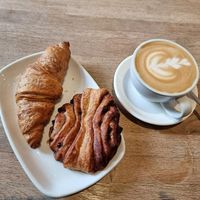 Vegan chocolate croissant and vegan chocolate swirl + oatmylk latte at Ecocafe in Budapest