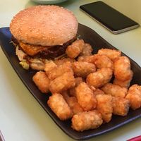 Baron burger with tater tots  at Two-Bit Villains in Adelaide