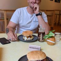 Two of the 'Chicken' burgers and a mint choc mylkshake. at Two-Bit Villains in Adelaide