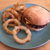 vegan cheeseburger with onion rings  at Two-Bit Villains in Adelaide