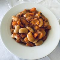 The gigantes (giant Lima beans with tomato sauce, olive oil, carrots, and celery) is a filling entree    at Amphora Restaurant in Crete