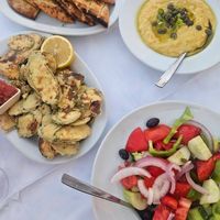 Greek salad (without feta), zucchini fritters, fava dip, pita at Amphora Restaurant in Crete