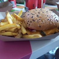 Double cheez beyond burger with mustard, ketchup and minced onions and pickles. Skin on salty fries. at The Saucy Cow in Cork