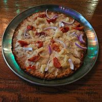 Vegan cauliflower crust with vegan cheese, tomato, red onion, and pineapple with herb-infused olive oil at Bru Daddy's Brewing Co in Allentown