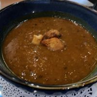 Cup of lentil soup; those croutons are likely non-vegan. I removed them and set them to the side    at Meze Moon in Chico