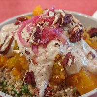 butternut roti, quinoa, chickpeas, parsley, pickles, pecan, zaatar sauce at Café Studio in Paris