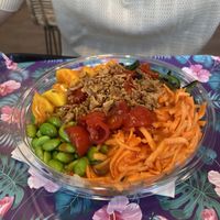 Custom vegan bowl with two different sorts of rice, seitan, tofu, mango, edamame etc.  at Poke Style in Trieste