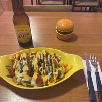 This had fried potatoes at the bottom, sauté vegetables, mushrooms and vegan sausage topped with sauces. Had a Malta to drink   at Antojitos de La Sirenita  in Puerto Ayora