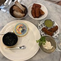 Caviar, mushroom croquettes, and whipped butterr  at Faubourg Daimant in Paris