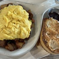Skillet with beyond sausage and Just eggs, dry sourdough toast. No vegan cheese available any more    at The Breakfast Company in Sarasota