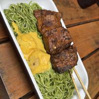 Pesto con anticuchos  at Oiga in Lima
