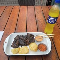 Medium portion of anticuchos with Inca kola   at Oiga in Lima