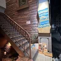 Sign for the restaurant - up the stairs   at Mer in Tokyo