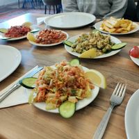Bulgar salad, potato salad, beans, spicy tomato, vine leaves, and chips at House Of Memories - Bayramın Yeri in Nevsehir