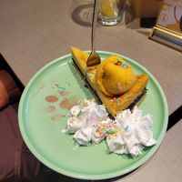 Poppy Cheesecake with mango sorbet, whipped cream and sprinkles at Katzentempel - Freiburg in Freiburg