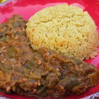 Emomi & Saffron Rice: "Dive into this luscious stew where okra meets a medley of onions, ginger, garlic, and tomatoes, all simmered together" at Asempe Kitchen in Ithaca