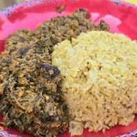 Egusi & Saffron Rice: "Rich and hearty, this traditional West African stew combines spinach with onions, ginger, garlic, tomatoes, and spices" at Asempe Kitchen in Ithaca