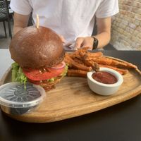 Vegan burger with sweet patatoe fries  at Lokāls Veranda in Jurmala