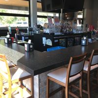 Bar area. The windows on the far side are retractable and open into a patio area when nice weather permits. at Mizzy's Pizza in Carver