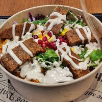 Çig köfte bowl with pomegranate, bulgur, and tahini sauce at 2 Brothers Gemüsedöner & Bowls in Saarbrucken