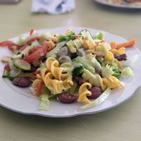 Main with mixed pasta, beans, soy meat, salad, vegetables, and an avocado sauce at Restaurante Vegetariano Zuvar in Puyo