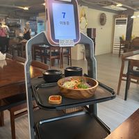 Robot bringing the bimbimbap. at Vegan Kitchen - 비건 키친 in Seoul