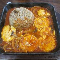 Braised soft tofu in a tomato-chilli sauce, with rice at Vegan Kitchen at Vegan Kitchen - 비건 키친 in Seoul