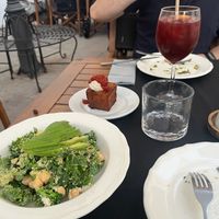 Kale caesar salad. Bravas cube in the background at L'Espai in Tossa De Mar