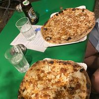 Pizza with ananas and sausage, and carbonara pizza  at Planty Pizza in Vienna