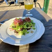 Sandwich with vegan pate and fresh orange juice   at De Carolinahoeve in De Steeg